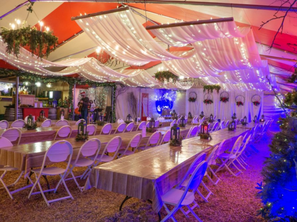 Festive family-friendly Biergarten with Christmas lights and draping