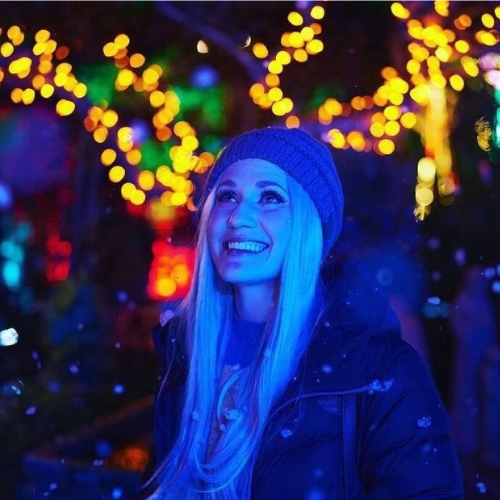 guest enjoying 3 million lights at the cambria christmas market